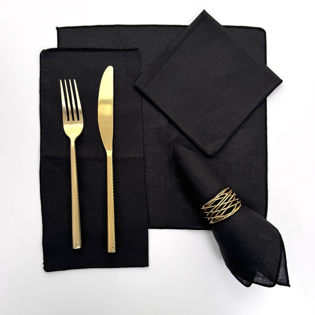 100% hemp black color table napkin pictured with 5 different ways to fold the napkin. Napkins have black threading on the edge.