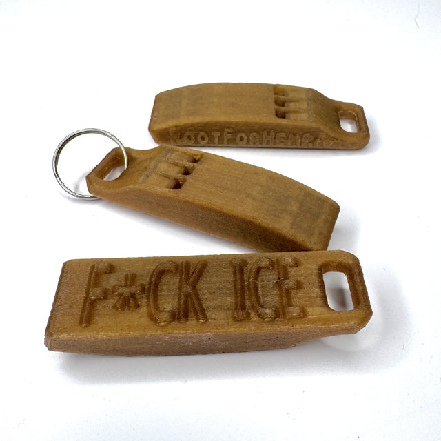 Brown keychain whistle with 'F*CK ICE' text on a white background