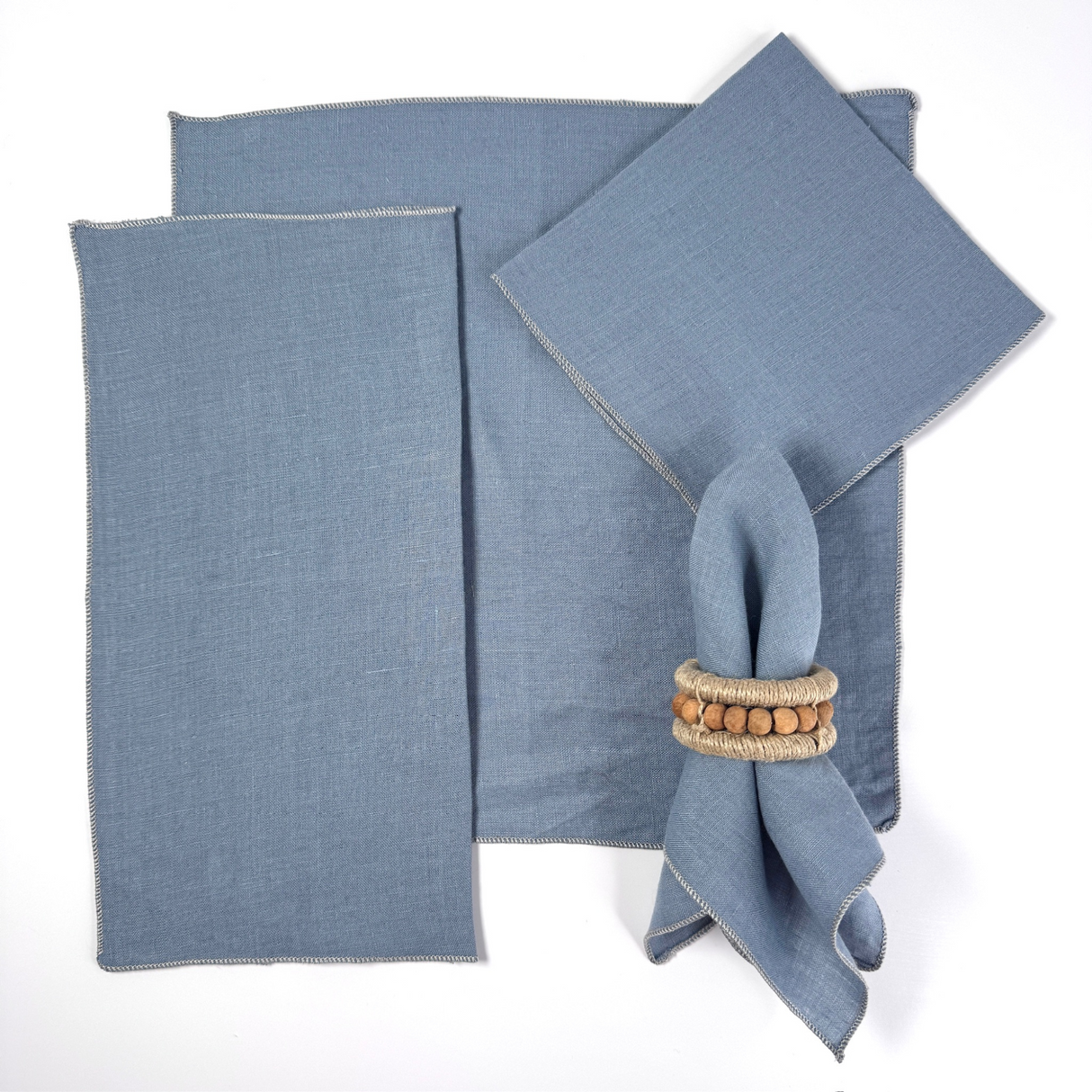 light blue napkins folded in various arrangements