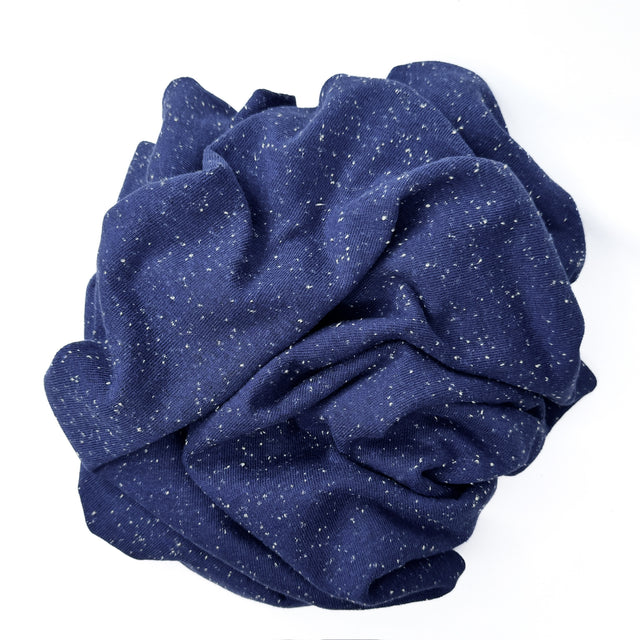 Blue jersey with white speckles on a white background