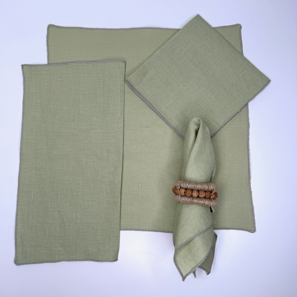 light green napkins folded in various arrangements