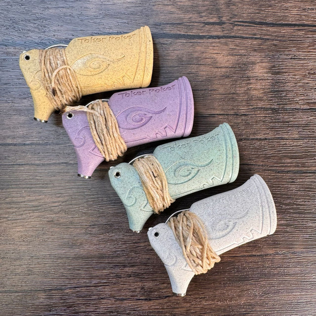 Back view of four toker pokers, each with hemp wick wrapped around them. Top is yellow, second from top is plum, second from bottom is light green, and bottom is light grey.