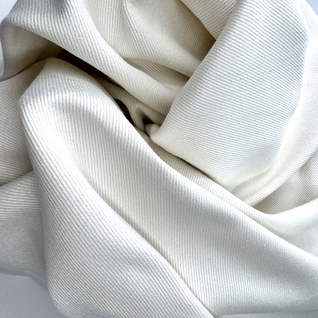 Close-up of white fabric with a textured pattern