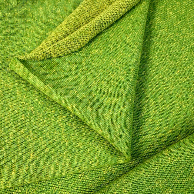 Close-up of green fabric with a textured pattern