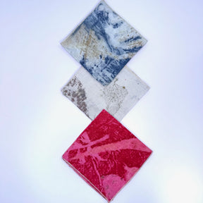 three folded hemp napkins - eco red, eco blue  and natural
