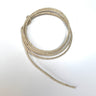 Natural wire hemp cord wound up in a circular stack.