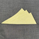 sage green pocket square  on a gray textured surface