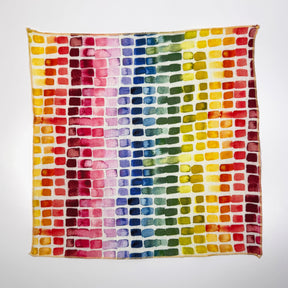 fabric  swatch with a grid of multicolored watercolor squares on a white background