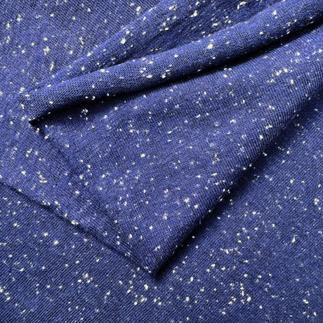 Close-up of blue fabric with white speckles
