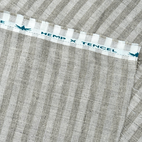 Textile with 'Hemp x Tencel' label on a striped fabric