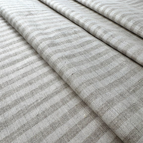 beige striped fabric with a subtle pattern