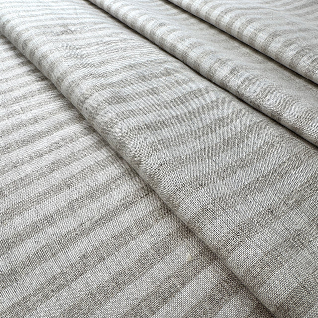 beige striped fabric with a subtle pattern