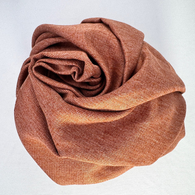 Terra Cotta Hemp Twill Balled in a spiral on white background