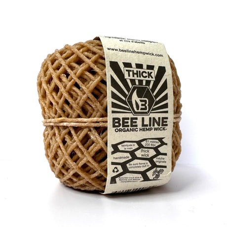 Full roll of Bee Line Thick Organic Hemp Wick in retail packaging with paper branded sleeve.