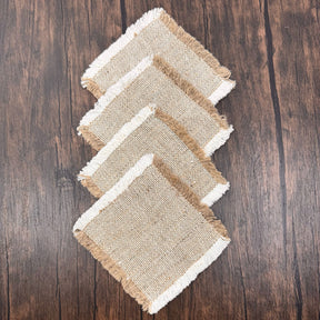 stack of 4 two toned hemp canvas coasters on wood surface