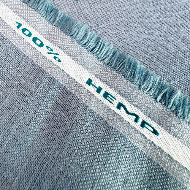 Blue woven fabric with '100% Hemp' label 