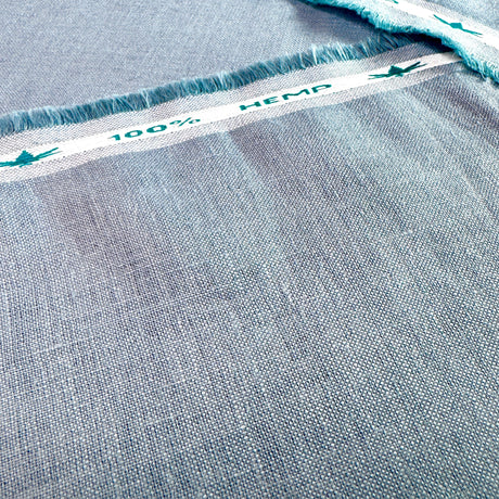 Close-up of blue hemp fabric with '100% Hemp' label