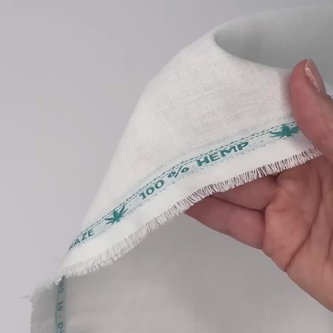 ultra lightweight hemp linen shown moving over hands
