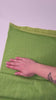 hand running over lime jersey knit fabric to show how to moved and color on both sides