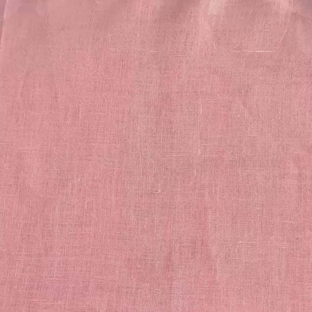 lightweight light pink hemp linen shown with hands and scrunched